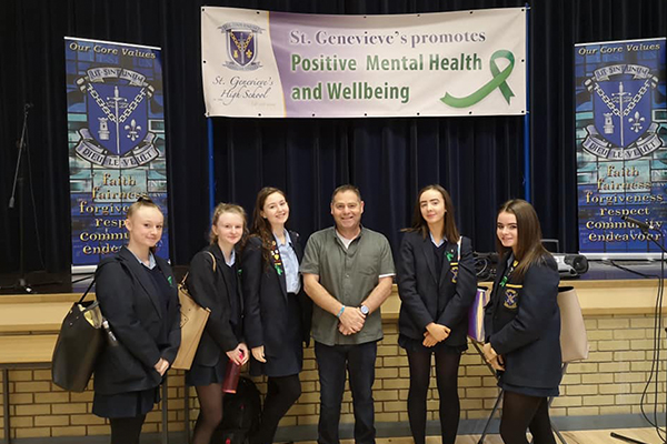 An image of Phillip teaching some school girls about suicide awareness